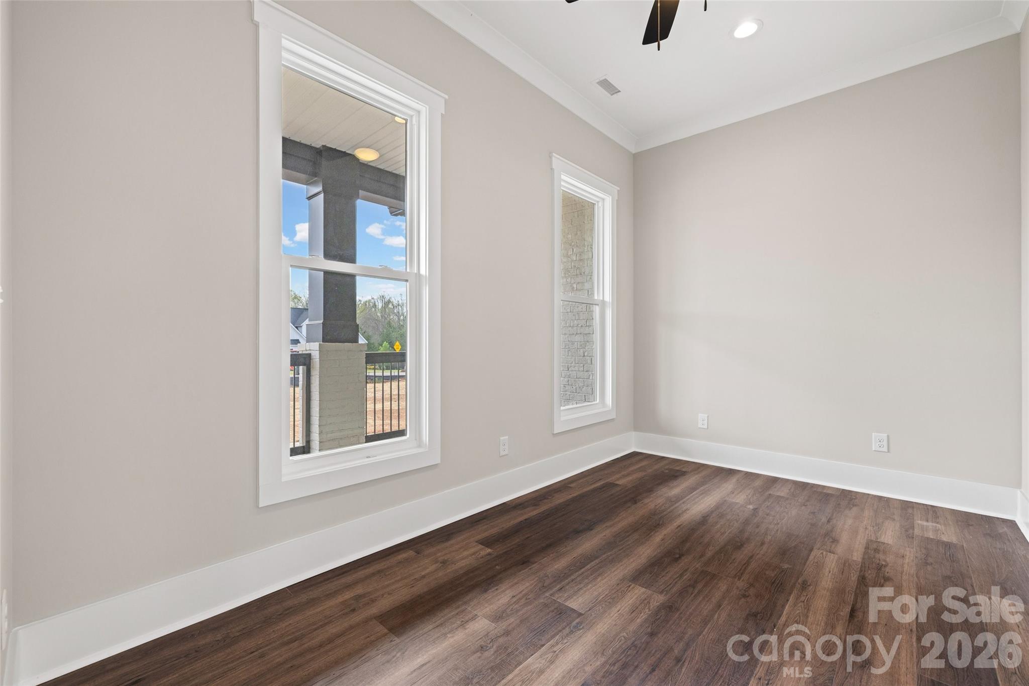 254 Triple Ponds Court Clover, SC 29710 - Photo 7 of 45 an empty room with wooden floor and windows
