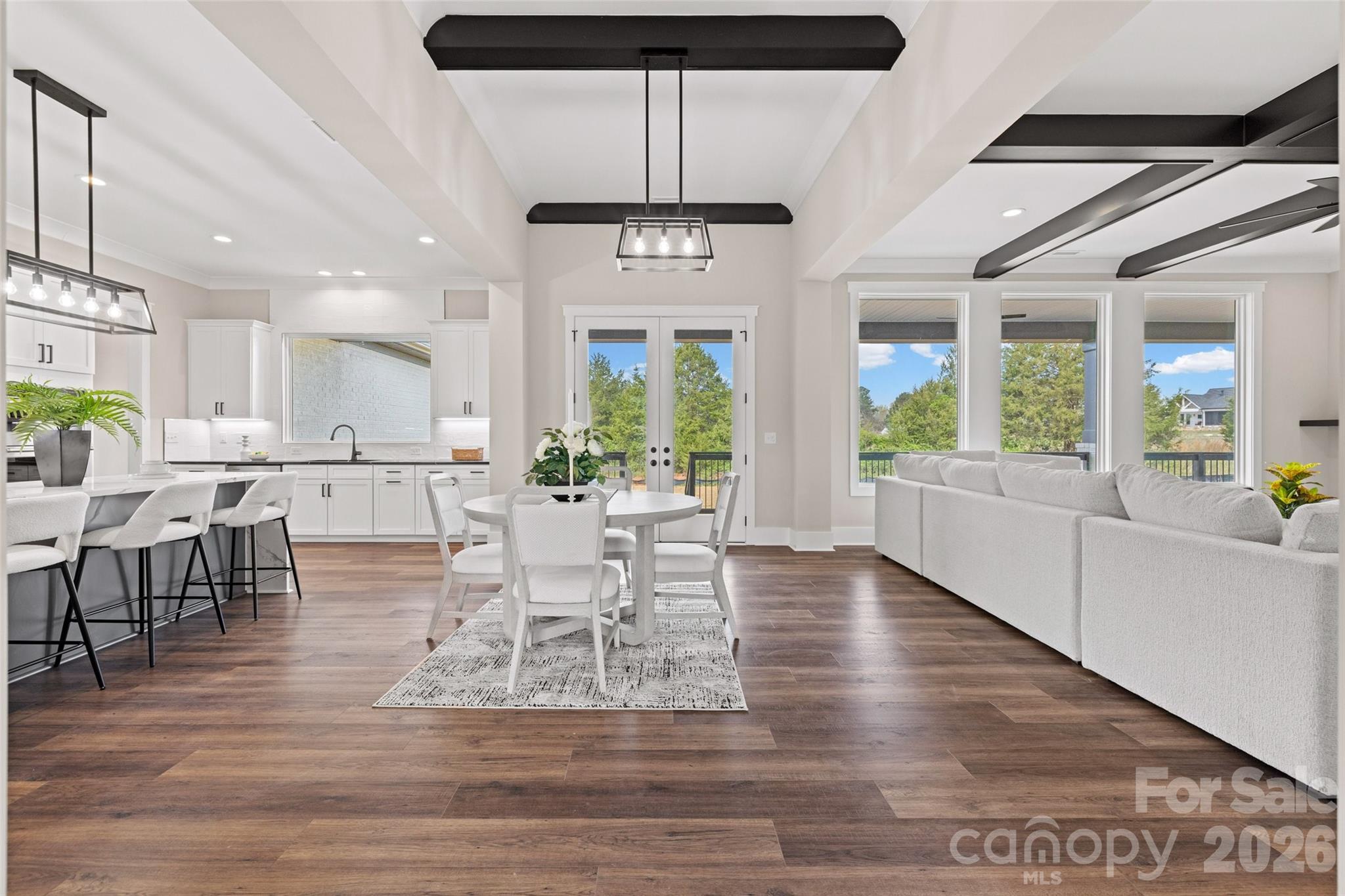 254 Triple Ponds Court Clover, SC 29710 - Photo 8 of 45 a view of a dining room with furniture window and wooden floor