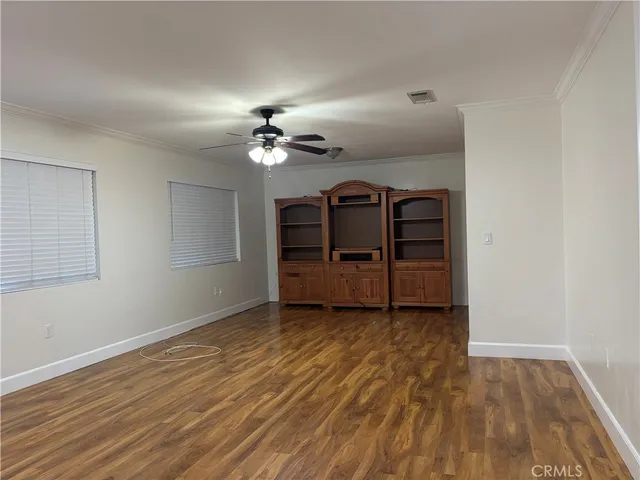 a view of an empty room with glass door