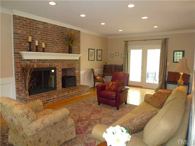 2604 Bembridge Drive Raleigh, NC 27613 - Photo 3 of 12 What a family room! Hardwood floors, wainscoting, crown molding, masonry gas log fireplace, recessed lghting and doors to deck. Perfect for entertaining!