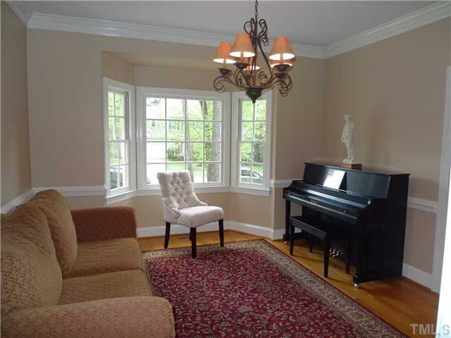 2604 Bembridge Drive Raleigh, NC 27613 - Photo 4 of 12 This spacious dining room w/ gorgeous hardwood floors, crown molding, chair rail & bay window is presently being used as a music room.