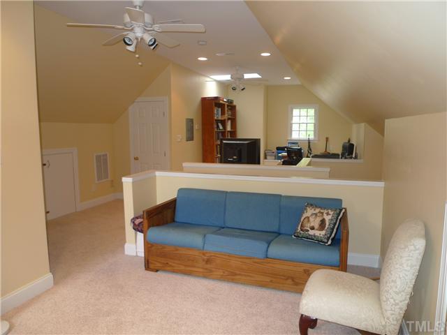 2604 Bembridge Drive Raleigh, NC 27613 - Photo 10 of 12 Finished third floor with two sections ... one being used as an office and the other as a sitting area. With lots of storage, two ceilings fans, skylight and pitched ceilings, this third floor presents great flex space for whatever you need.