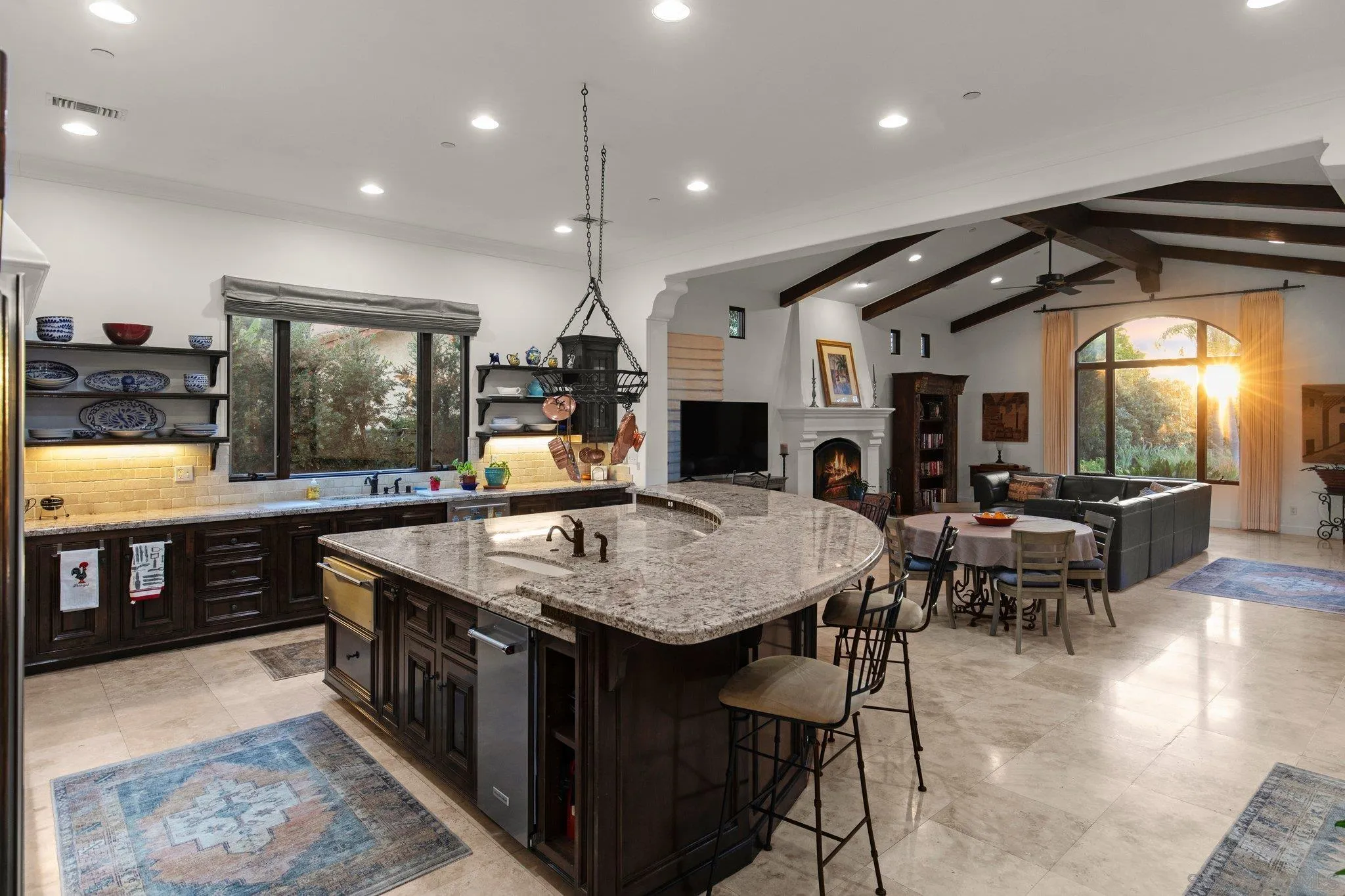 29746 Nella Lane Bonsall, CA 92084 - Photo 13 of 39 a living room with stainless steel appliances kitchen island granite countertop a table chairs and a wooden floor