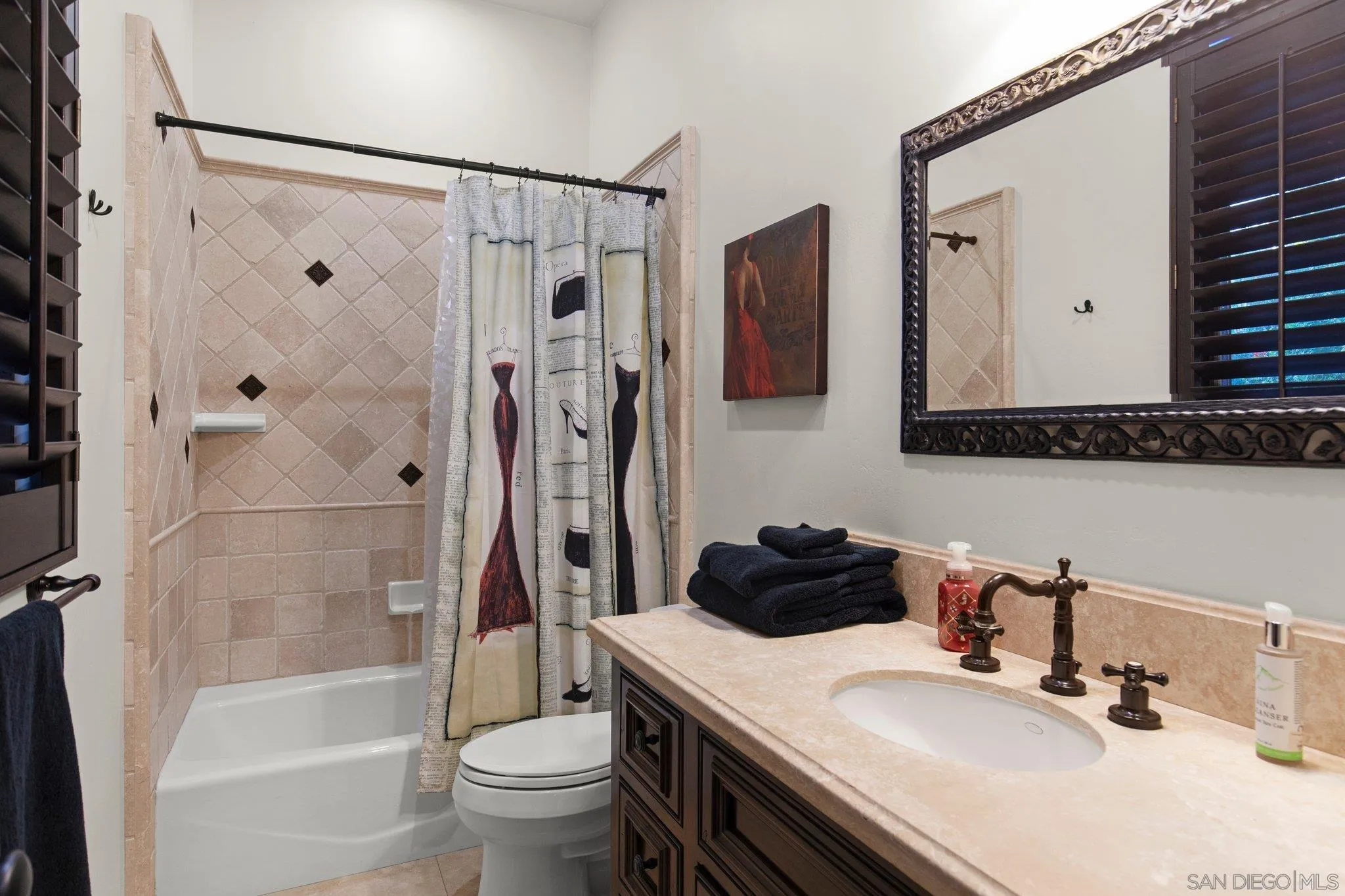 29746 Nella Lane Bonsall, CA 92084 - Photo 16 of 39 a bathroom with a sink a toilet and a mirror