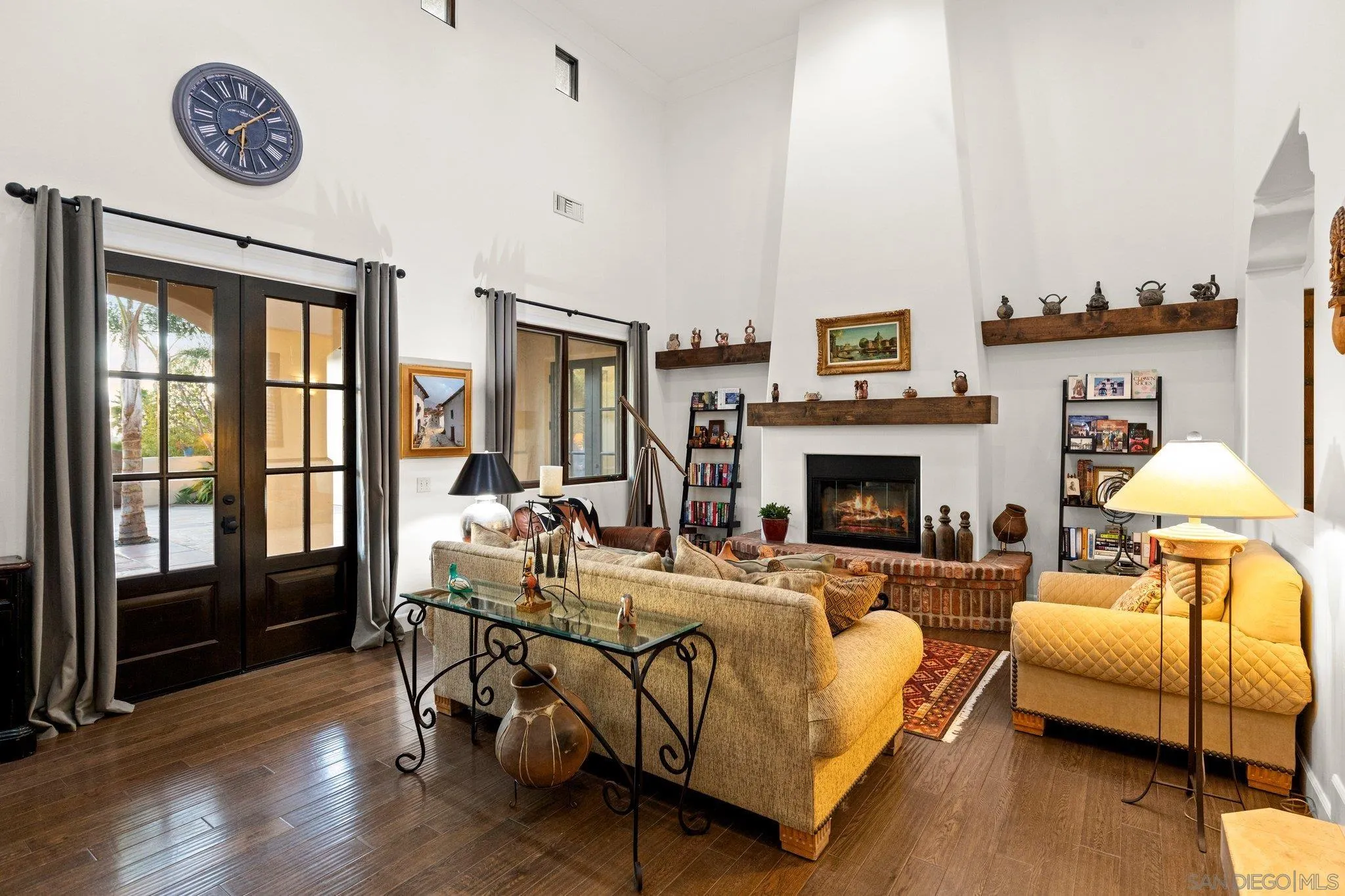 29746 Nella Lane Bonsall, CA 92084 - Photo 2 of 39 a living room with furniture a fireplace and a table