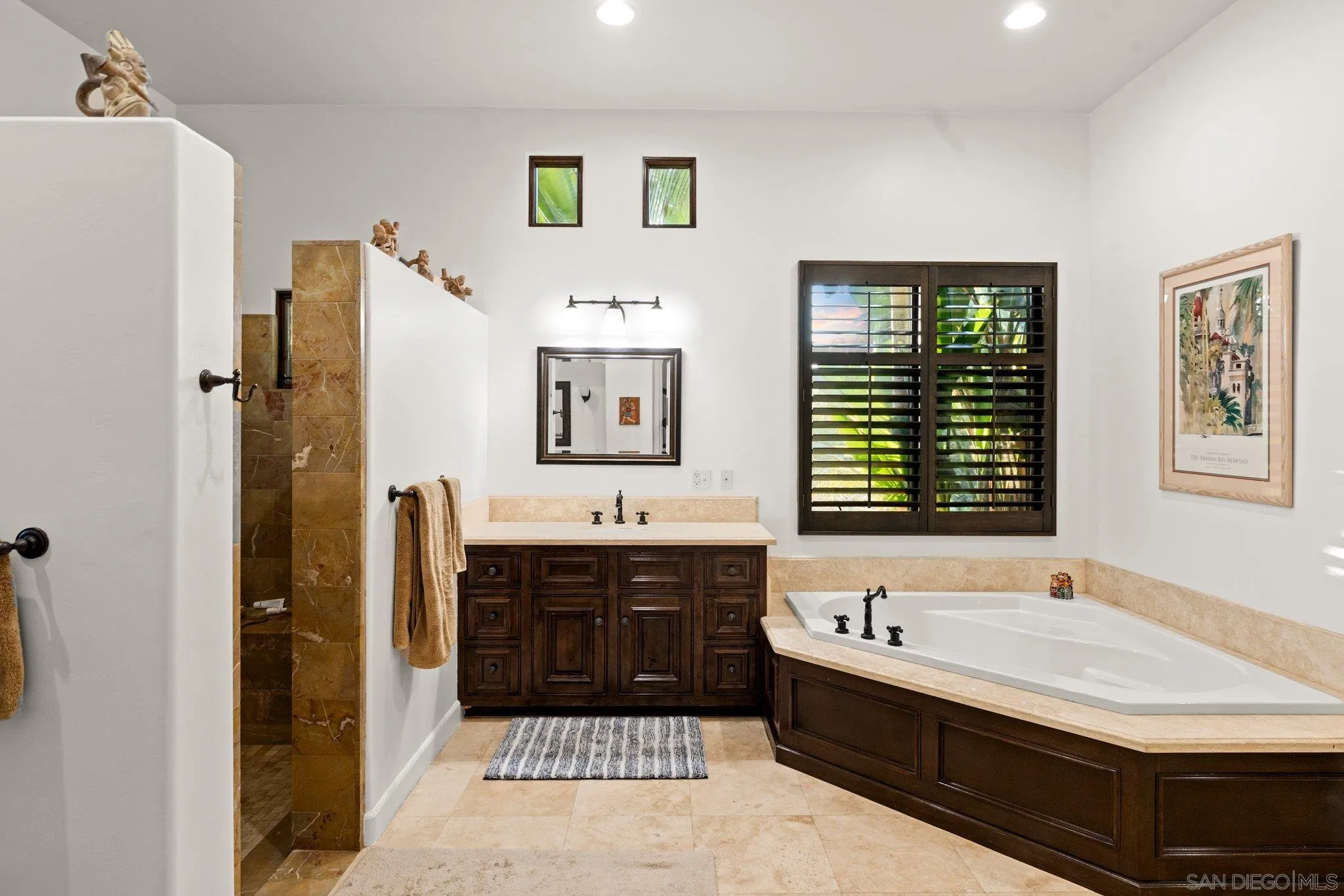 29746 Nella Lane Bonsall, CA 92084 - Photo 22 of 39 a bathroom with a tub sink and mirror