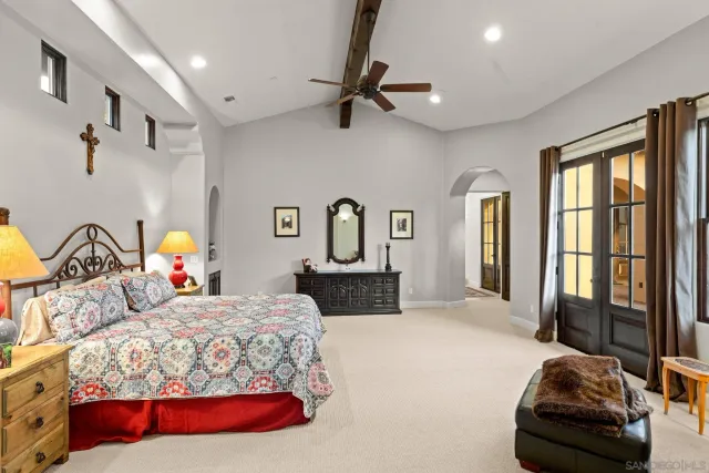 a bedroom with a bed and window