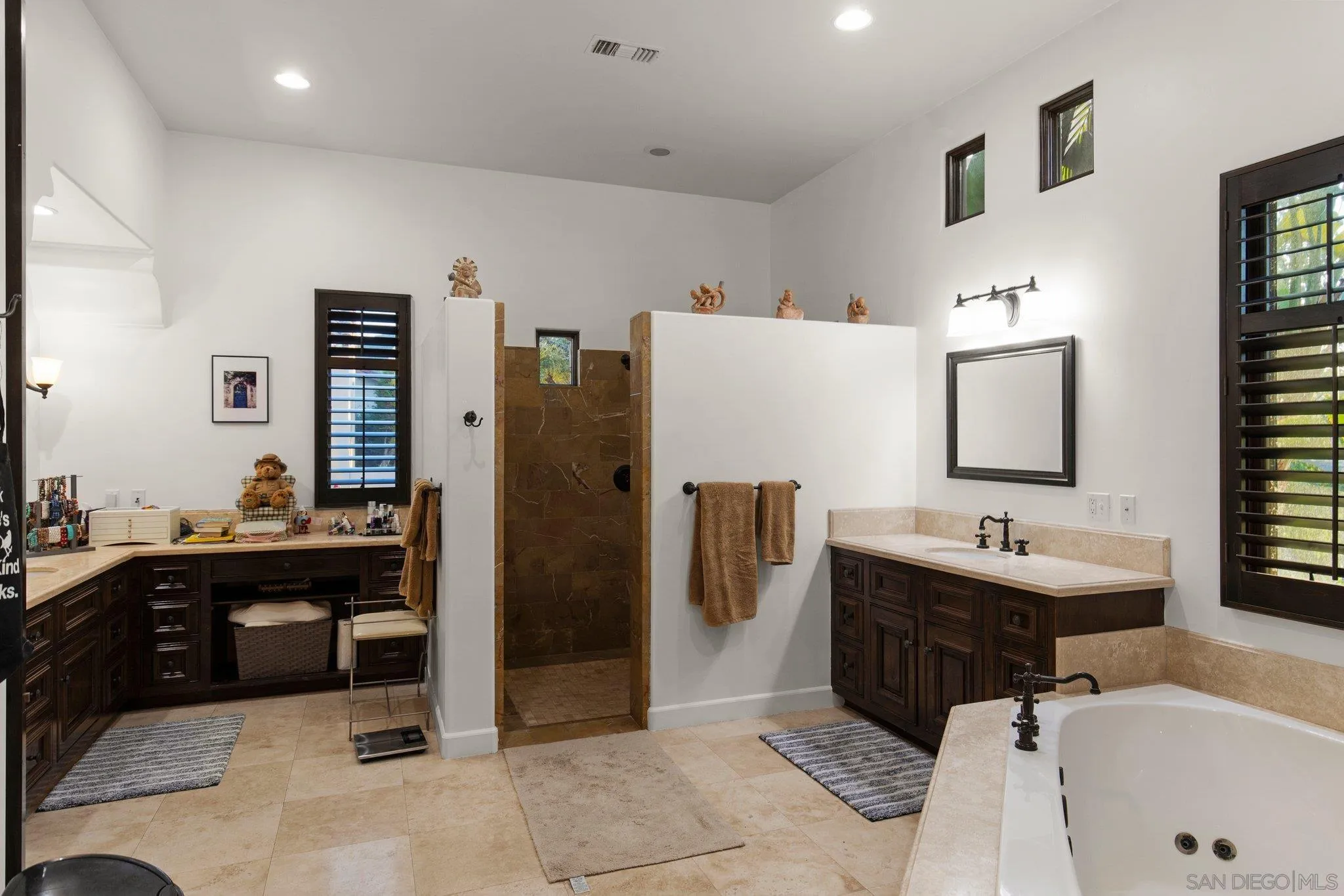 29746 Nella Lane Bonsall, CA 92084 - Photo 24 of 39 a bathroom with a tub sink and mirror