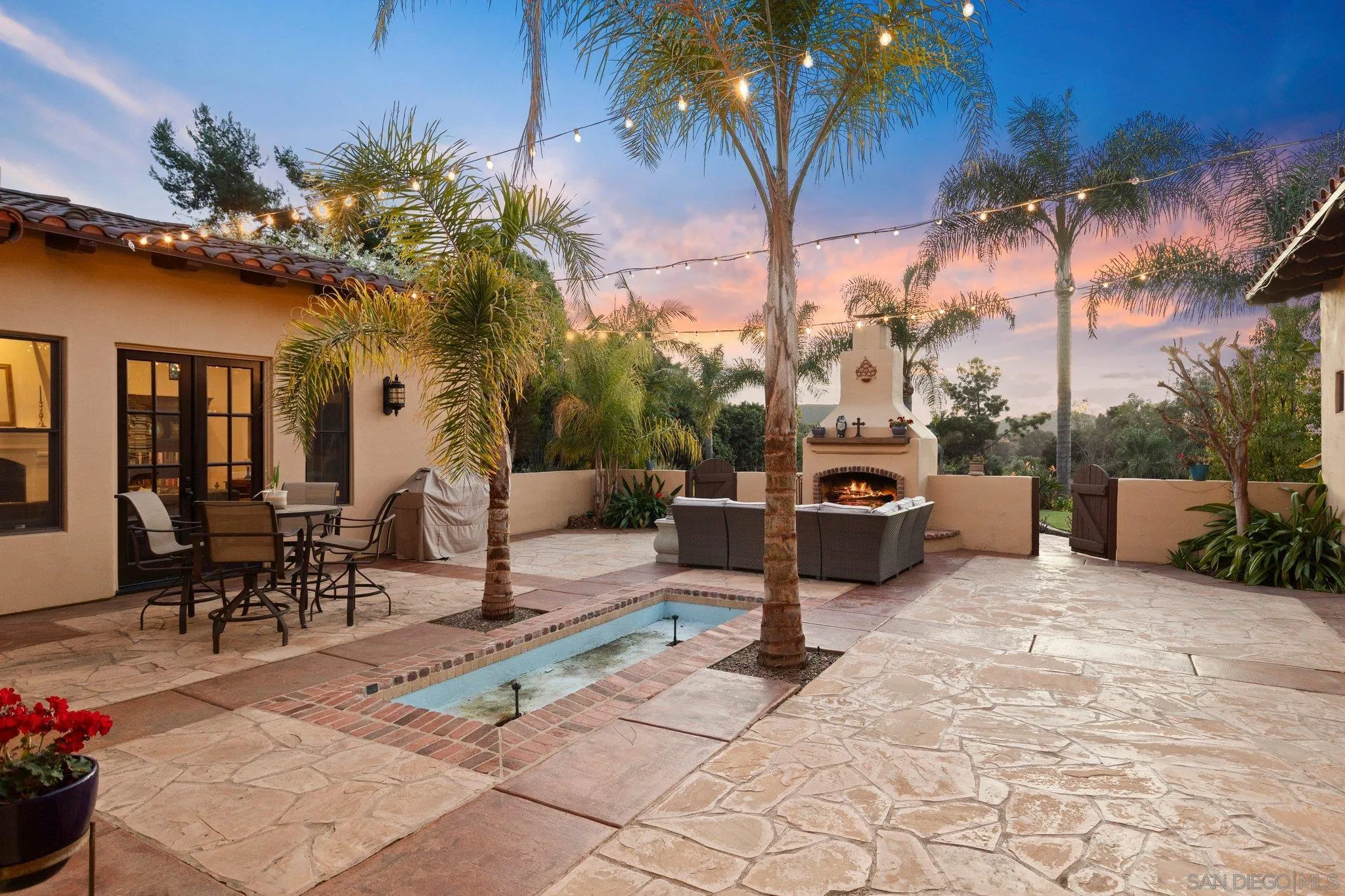 29746 Nella Lane Bonsall, CA 92084 - Photo 33 of 39 a building outdoor space with patio furniture and a fire pit