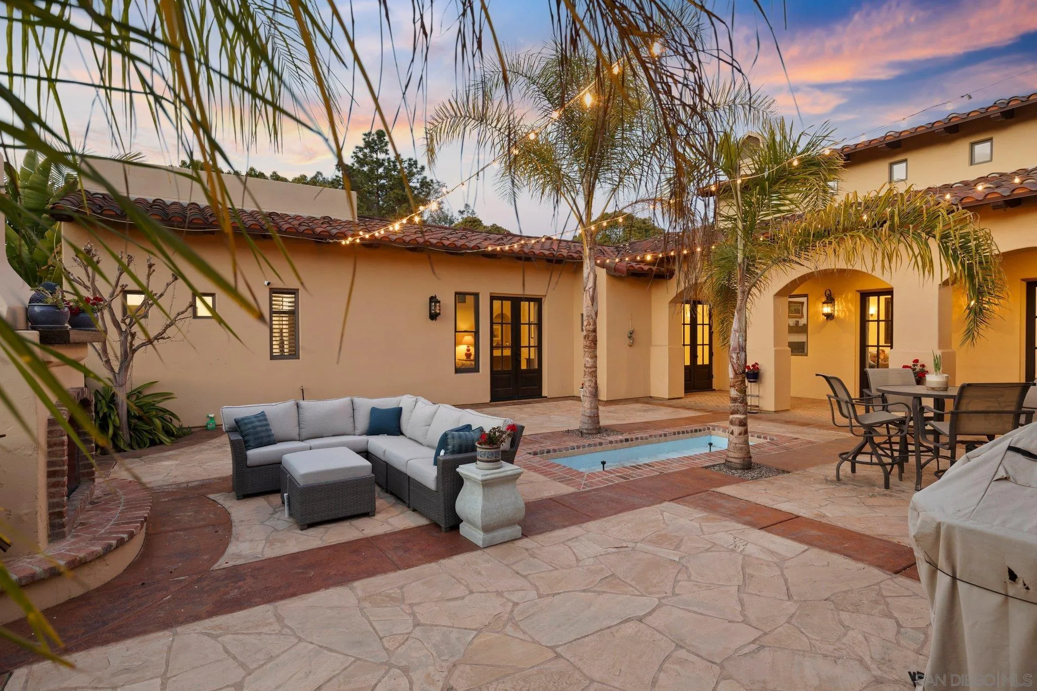29746 Nella Lane Bonsall, CA 92084 - Photo 34 of 39 a building outdoor space with patio furniture and potted plants