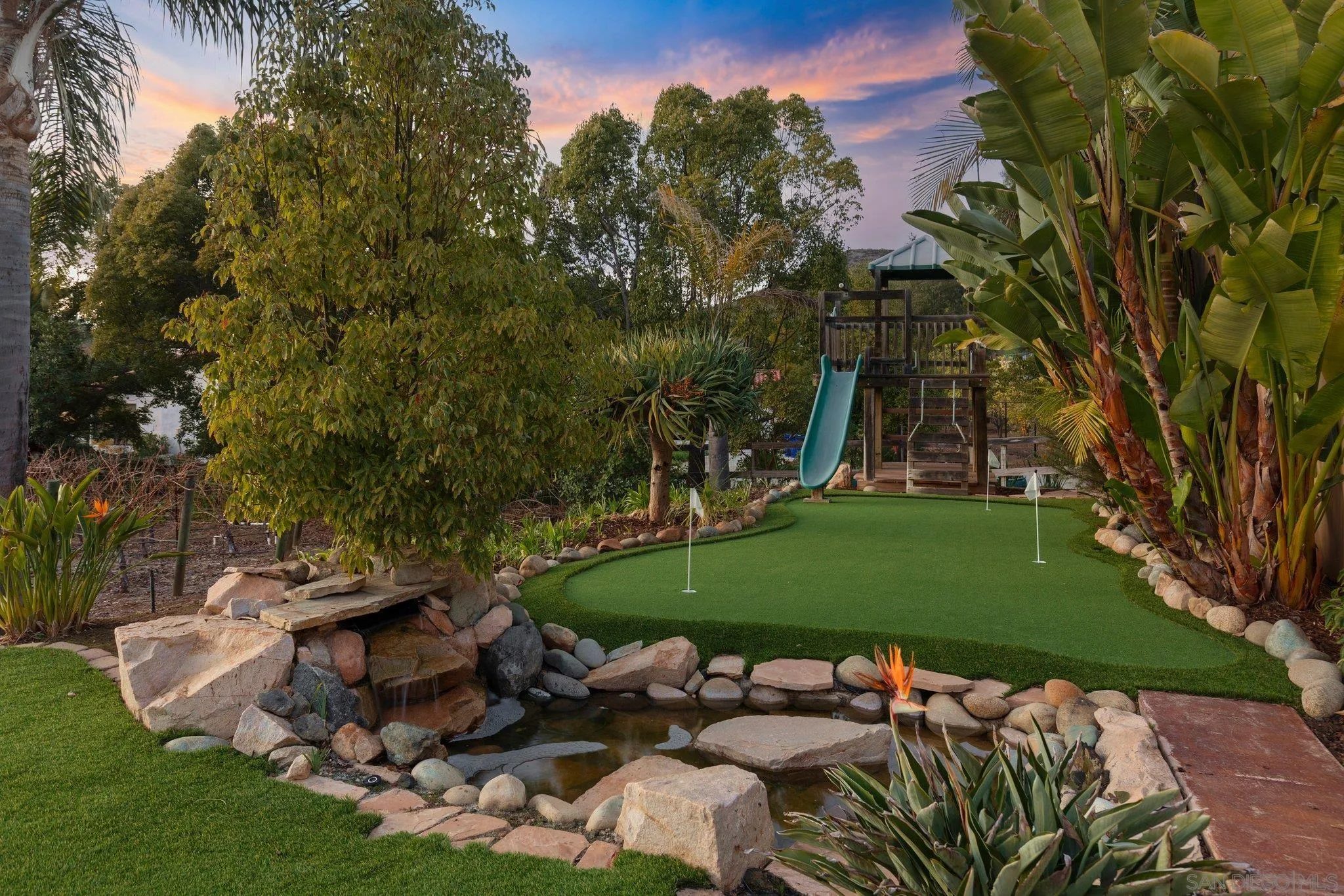 29746 Nella Lane Bonsall, CA 92084 - Photo 37 of 39 a view of a backyard with plants and a patio