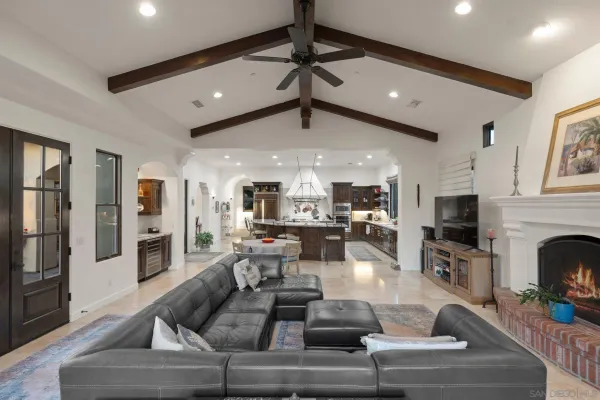 a living room with fireplace furniture and a flat screen tv