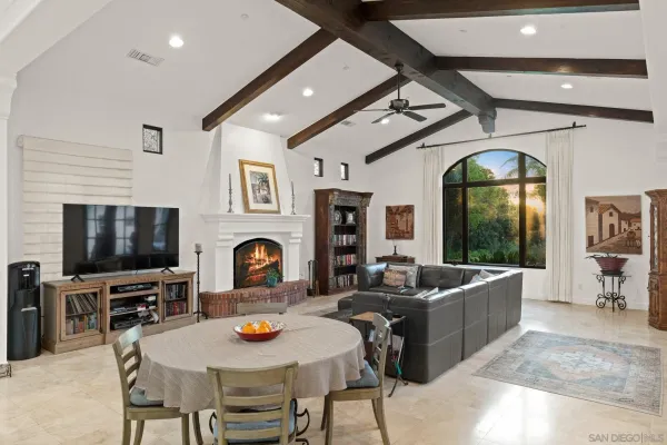a living room with fireplace furniture and a flat screen tv