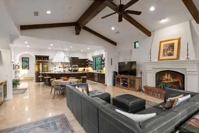 a living room with fireplace furniture and a flat screen tv