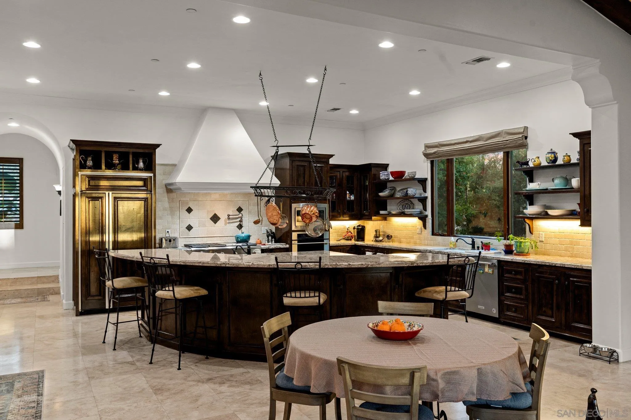 29746 Nella Lane Bonsall, CA 92084 - Photo 8 of 39 a kitchen with a table and chairs in it