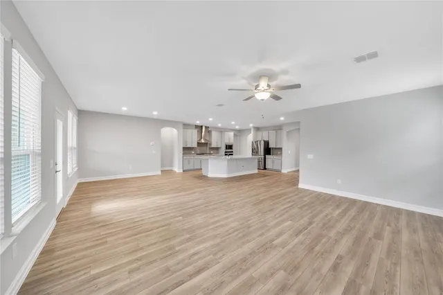 a view of a kitchen with a sink and a window