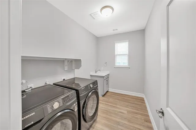 a utility room with dryer and washer