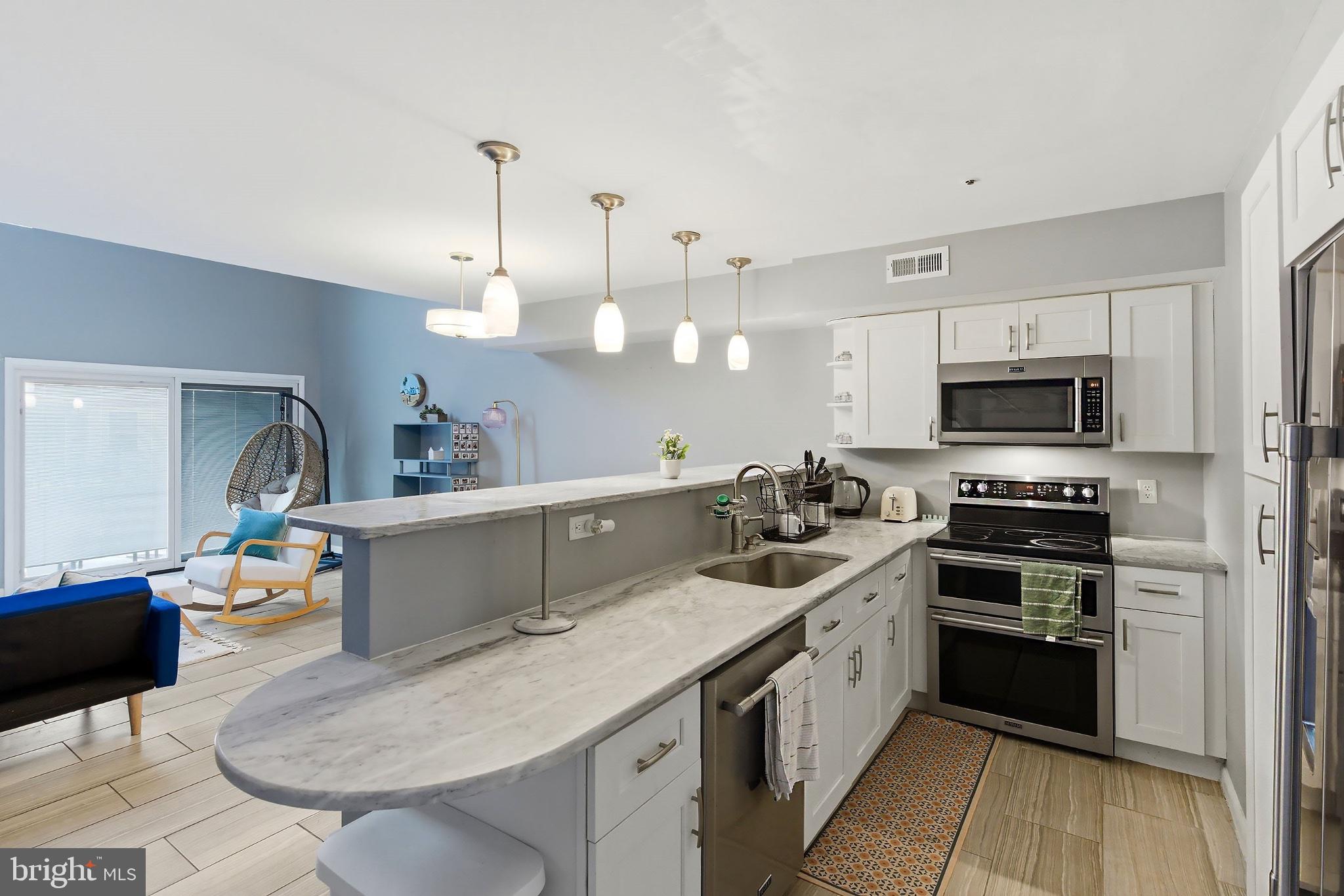 3036 Main Street, Unit 3036 Voorhees, NJ 08043 - Photo 7 of 24 Modern kitchen with stylish finishes.