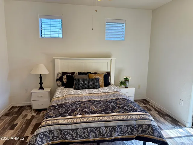 a bedroom with a bed and a mirror