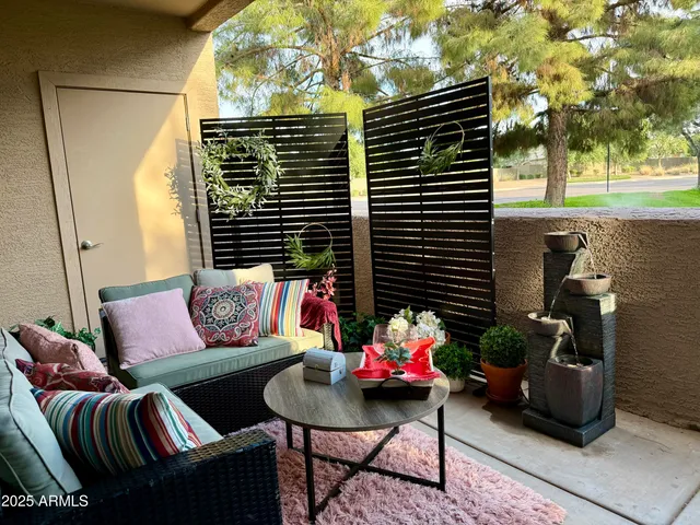 a outdoor living space with patio furniture and a potted plant