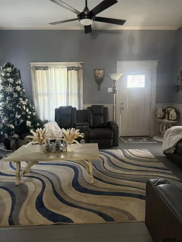 a living room with furniture and a window