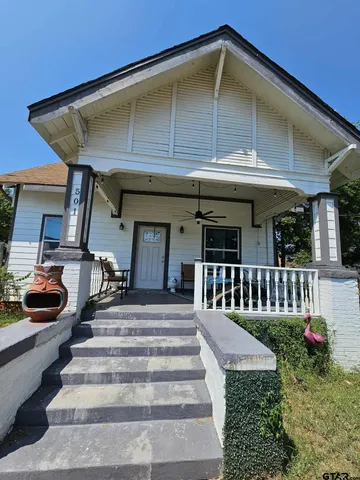 a bedroom with bed and a window