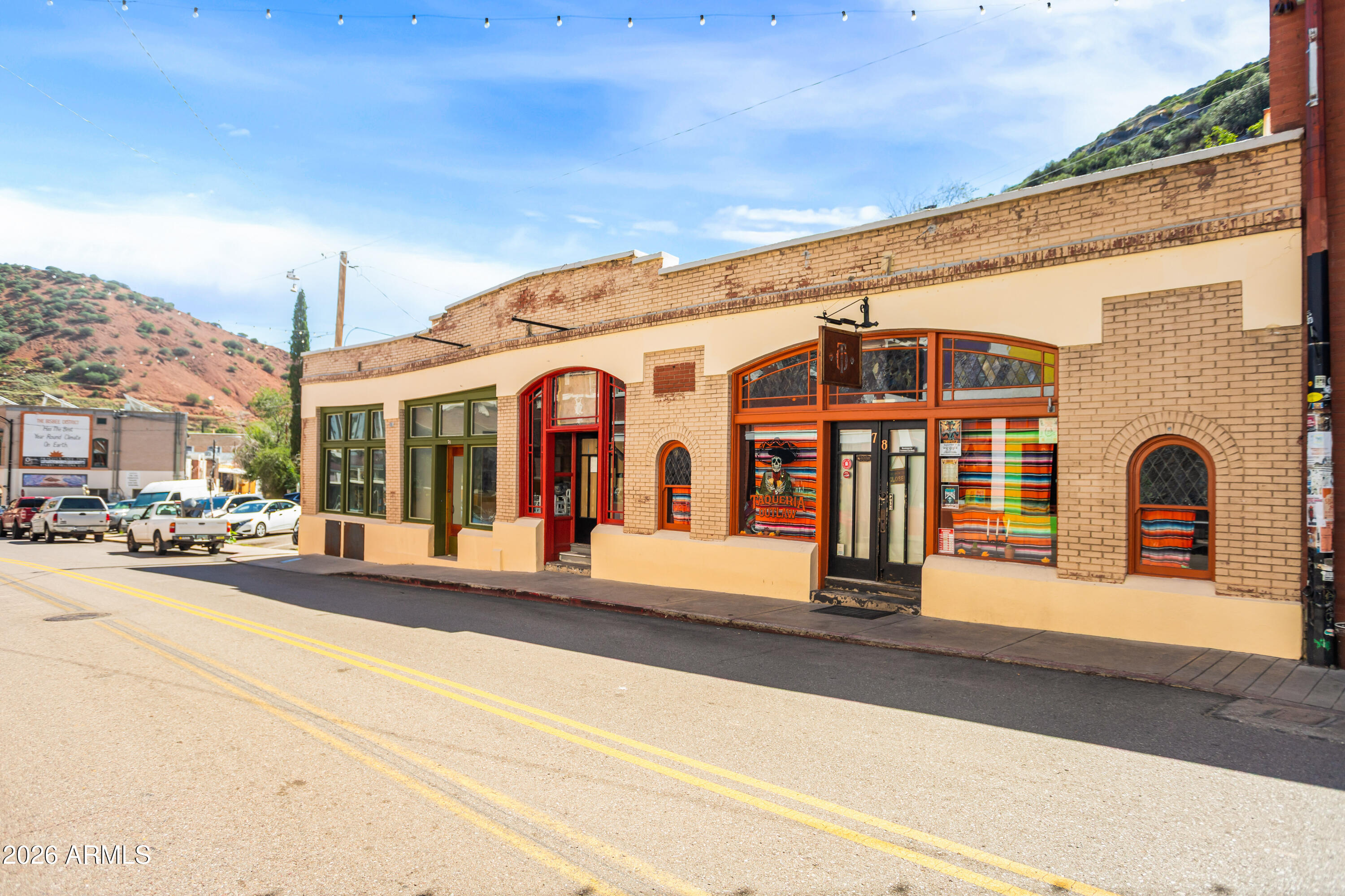 72-78 Main Street Bisbee, AZ 85603 - Photo 2 of 46 a front view of a building with a porch