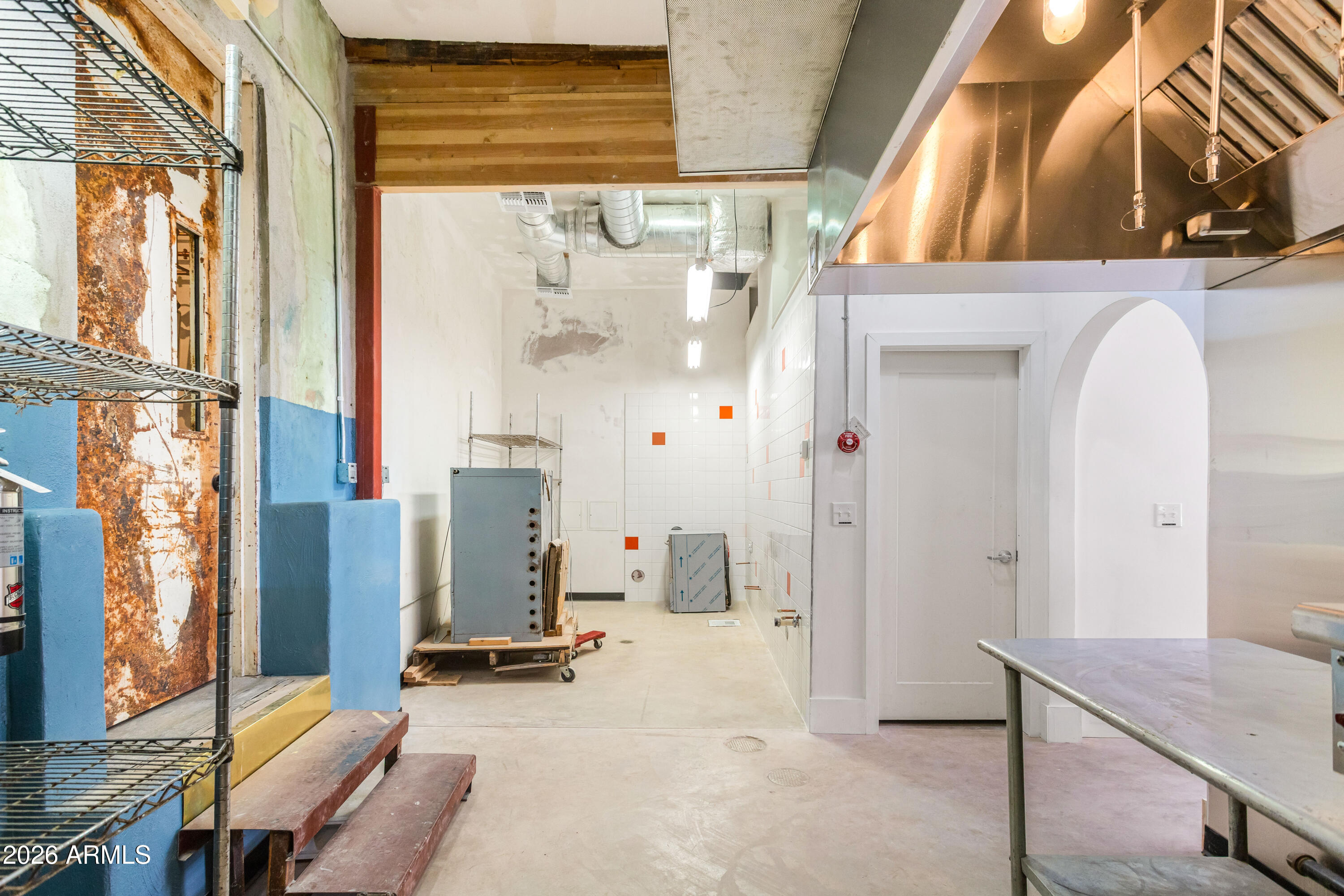 72-78 Main Street Bisbee, AZ 85603 - Photo 23 of 46 a view of hall way with furniture and windows