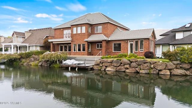 a front view of a house with a small yard