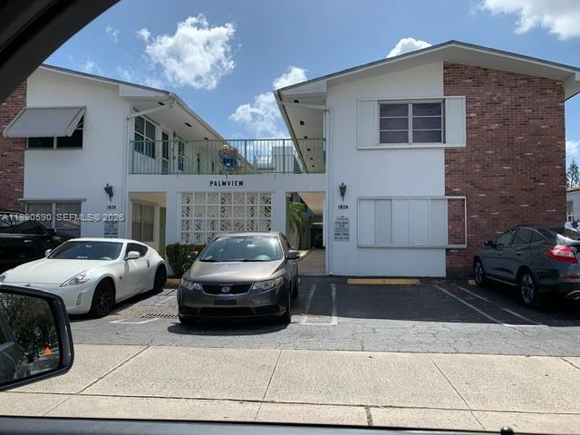 1824 Monroe Street, Unit 4 Hollywood, FL 33020 - Photo 2 of 28 a front view of a house with parking space