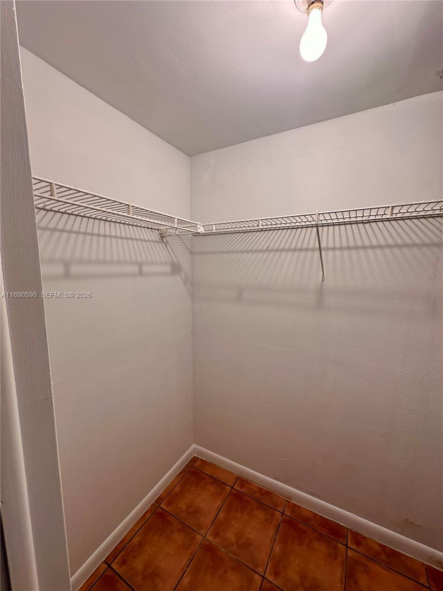 1824 Monroe Street, Unit 4 Hollywood, FL 33020 - Photo 21 of 28 a view of a room with racks on the wall