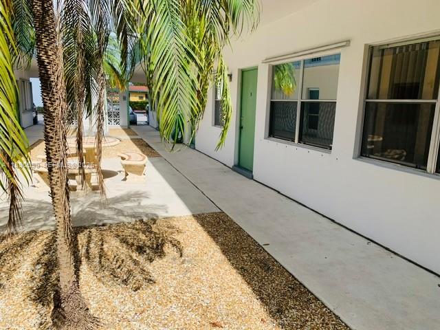 1824 Monroe Street, Unit 4 Hollywood, FL 33020 - Photo 3 of 28 a view of balcony with wooden floor and door