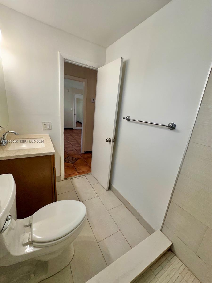 1824 Monroe Street, Unit 4 Hollywood, FL 33020 - Photo 8 of 28 a bathroom with a sink and a toilet