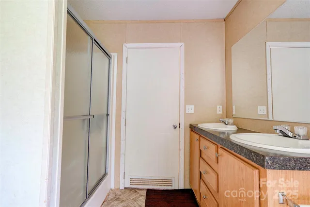 a view of a bathroom with tub