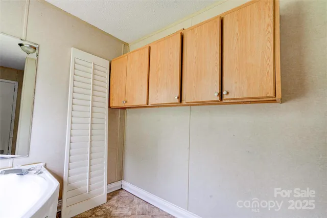 an empty room with a empty space and a window