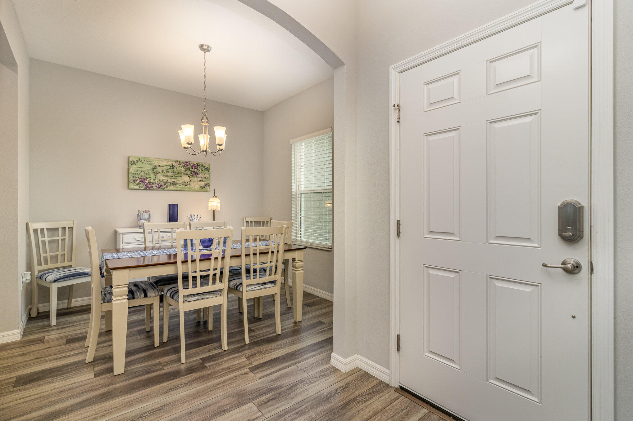8512 Laguna Circle Micco, FL 32976 - Photo 10 of 24 an open kitchen with dining table and chairs
