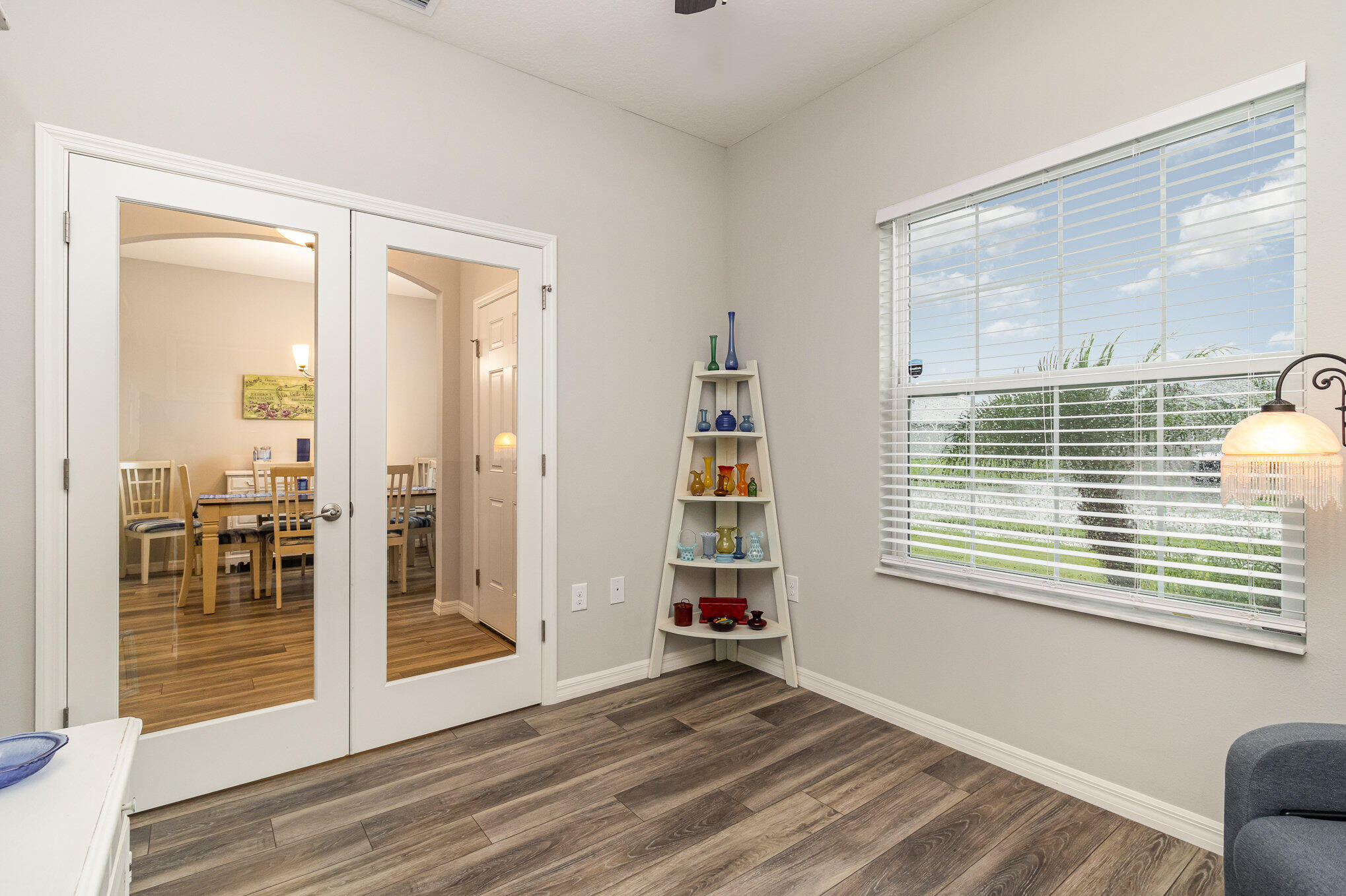8512 Laguna Circle Micco, FL 32976 - Photo 12 of 24 a view of empty room with wooden floor and fan