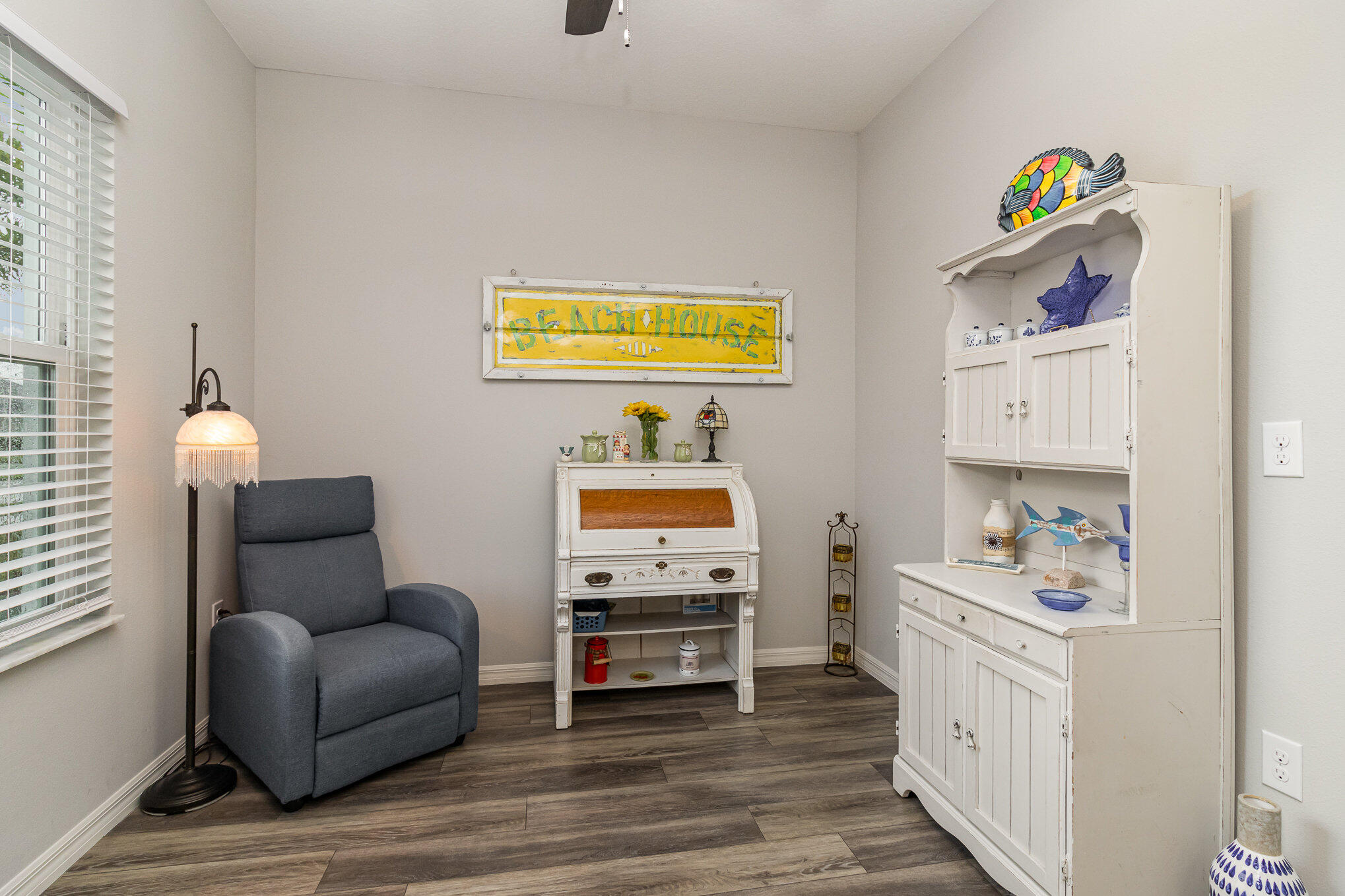 8512 Laguna Circle Micco, FL 32976 - Photo 13 of 24 a bedroom with furniture and a wooden floor