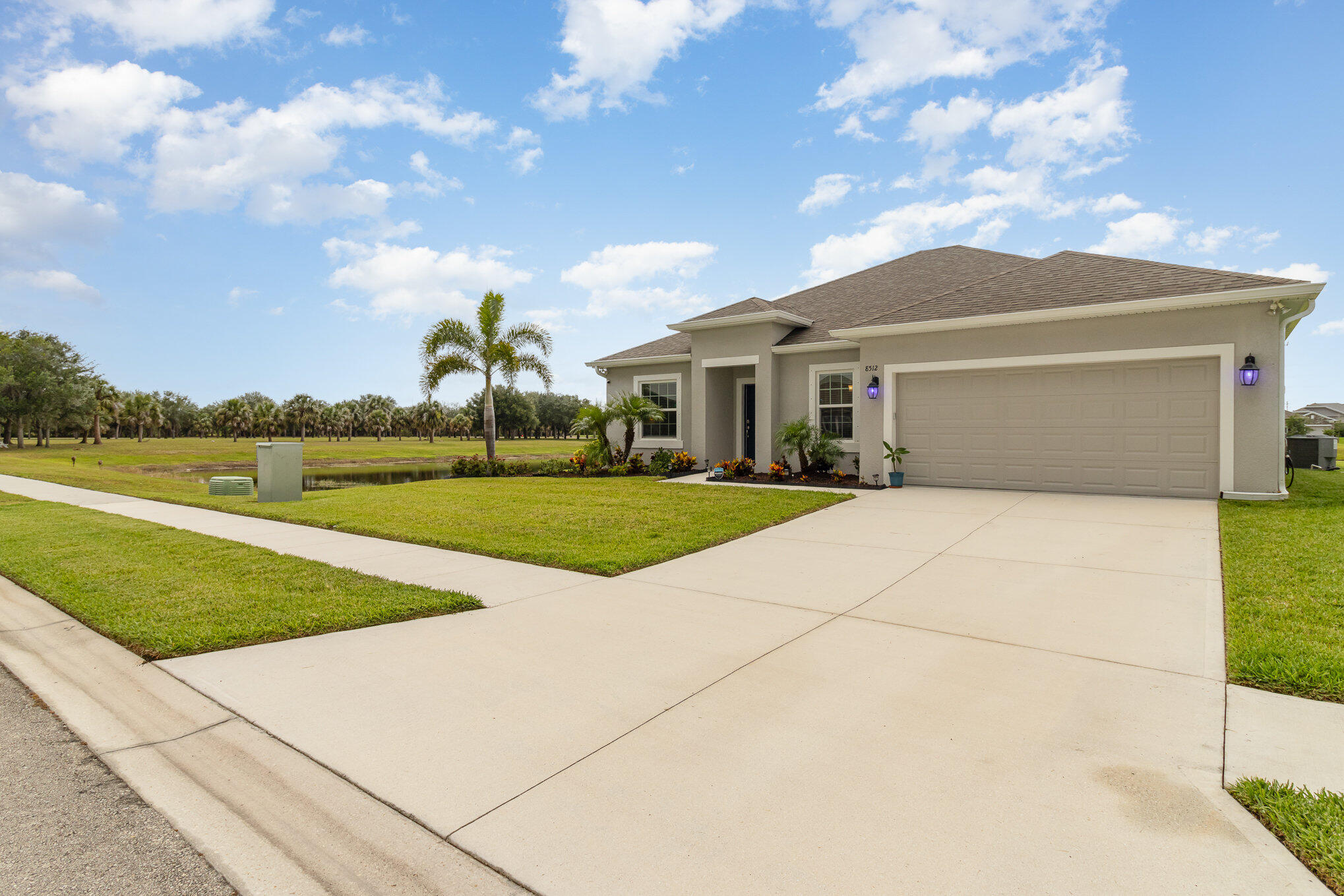 8512 Laguna Circle Micco, FL 32976 - Photo 3 of 24 a front view of a house with garden
