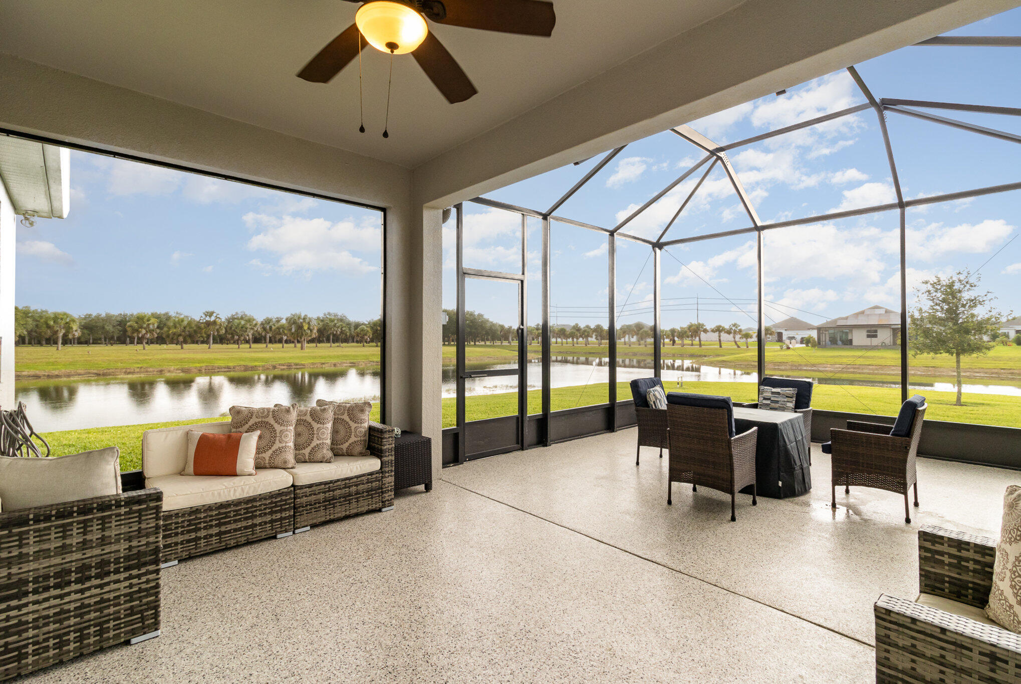8512 Laguna Circle Micco, FL 32976 - Photo 4 of 24 a living room with hardwood floor and large windows