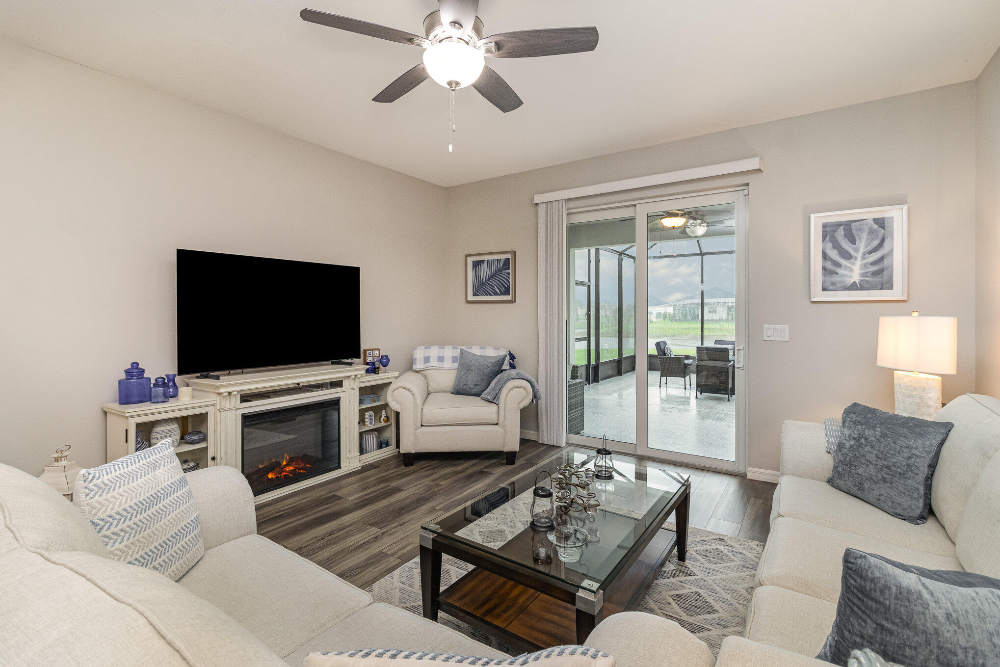 8512 Laguna Circle Micco, FL 32976 - Photo 22 of 24 a living room with furniture and a flat screen tv
