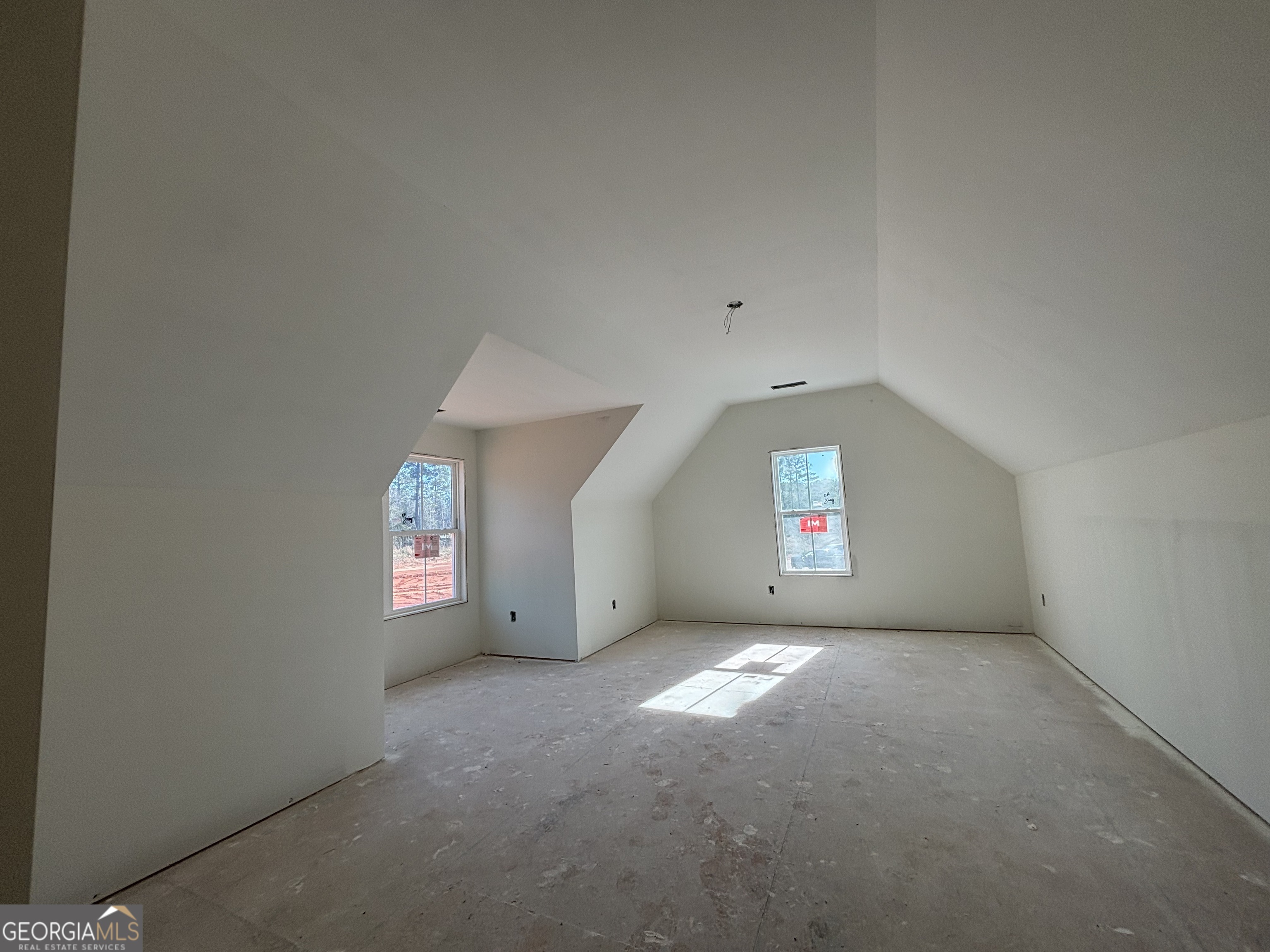 131 Hawthorne Lane Forsyth, GA 31029 - Photo 11 of 14 an empty room with windows and entrance