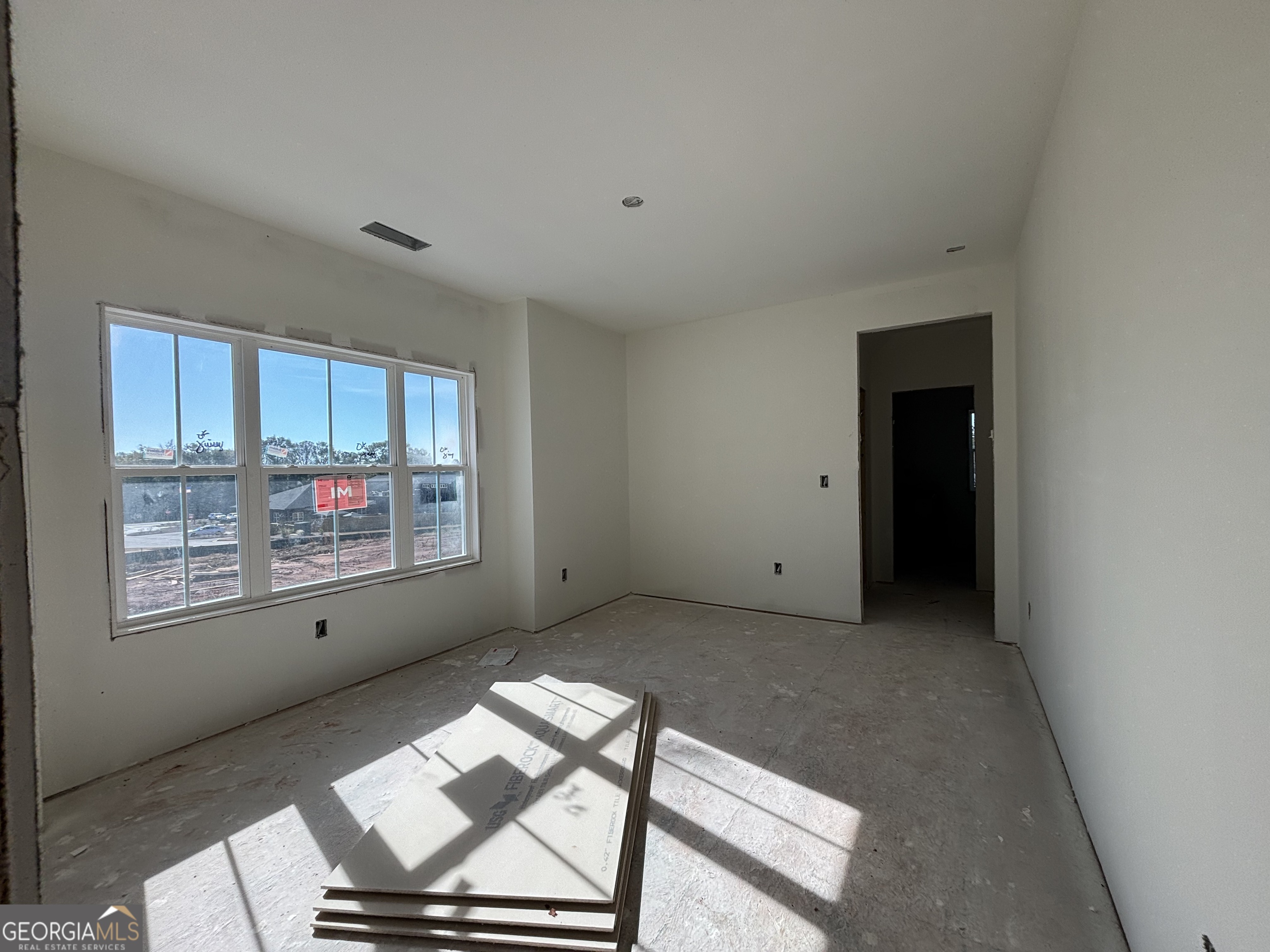 131 Hawthorne Lane Forsyth, GA 31029 - Photo 12 of 14 a view of an empty room with a window