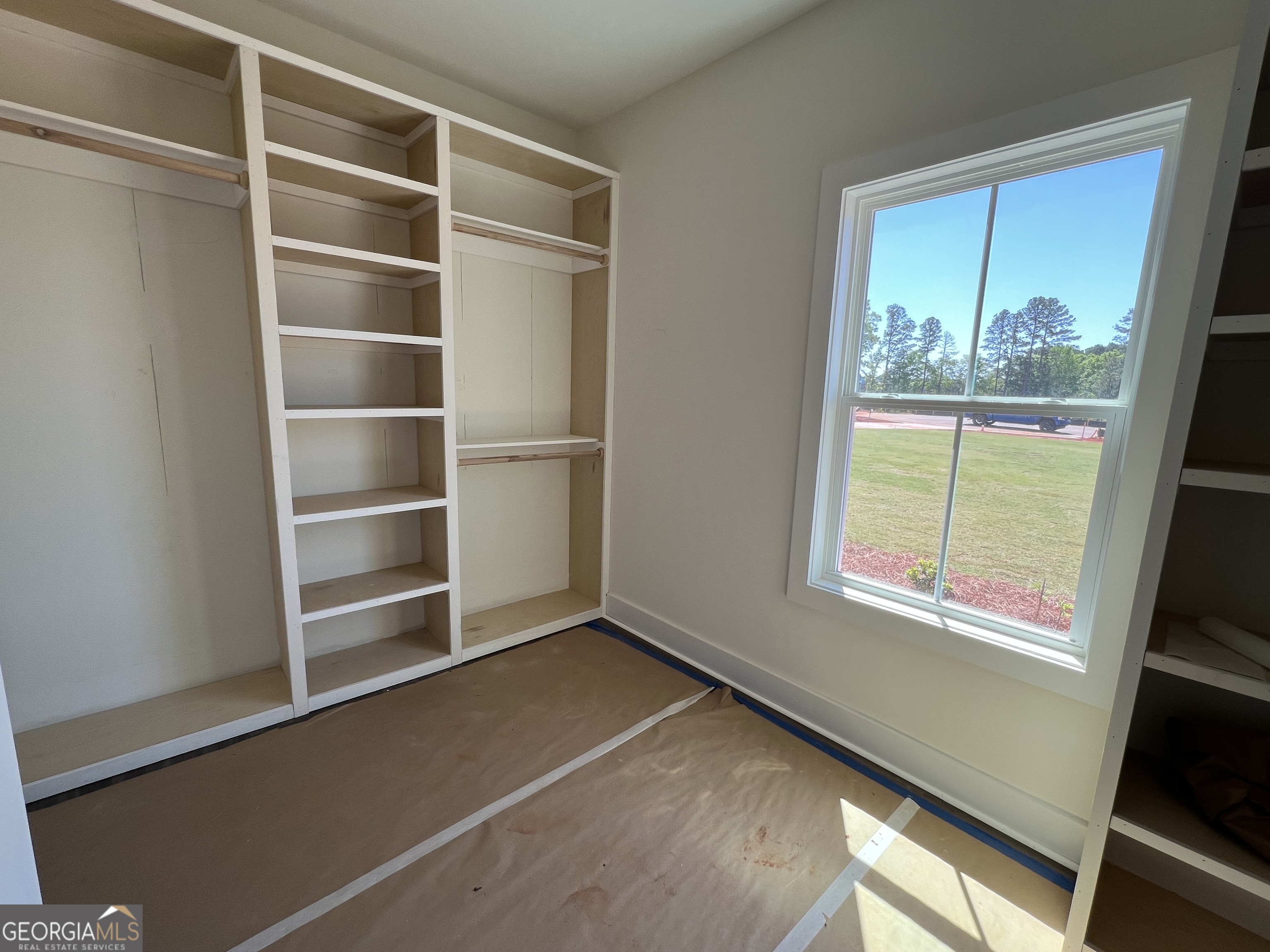 131 Hawthorne Lane Forsyth, GA 31029 - Photo 19 of 31 a view of an empty room with a window