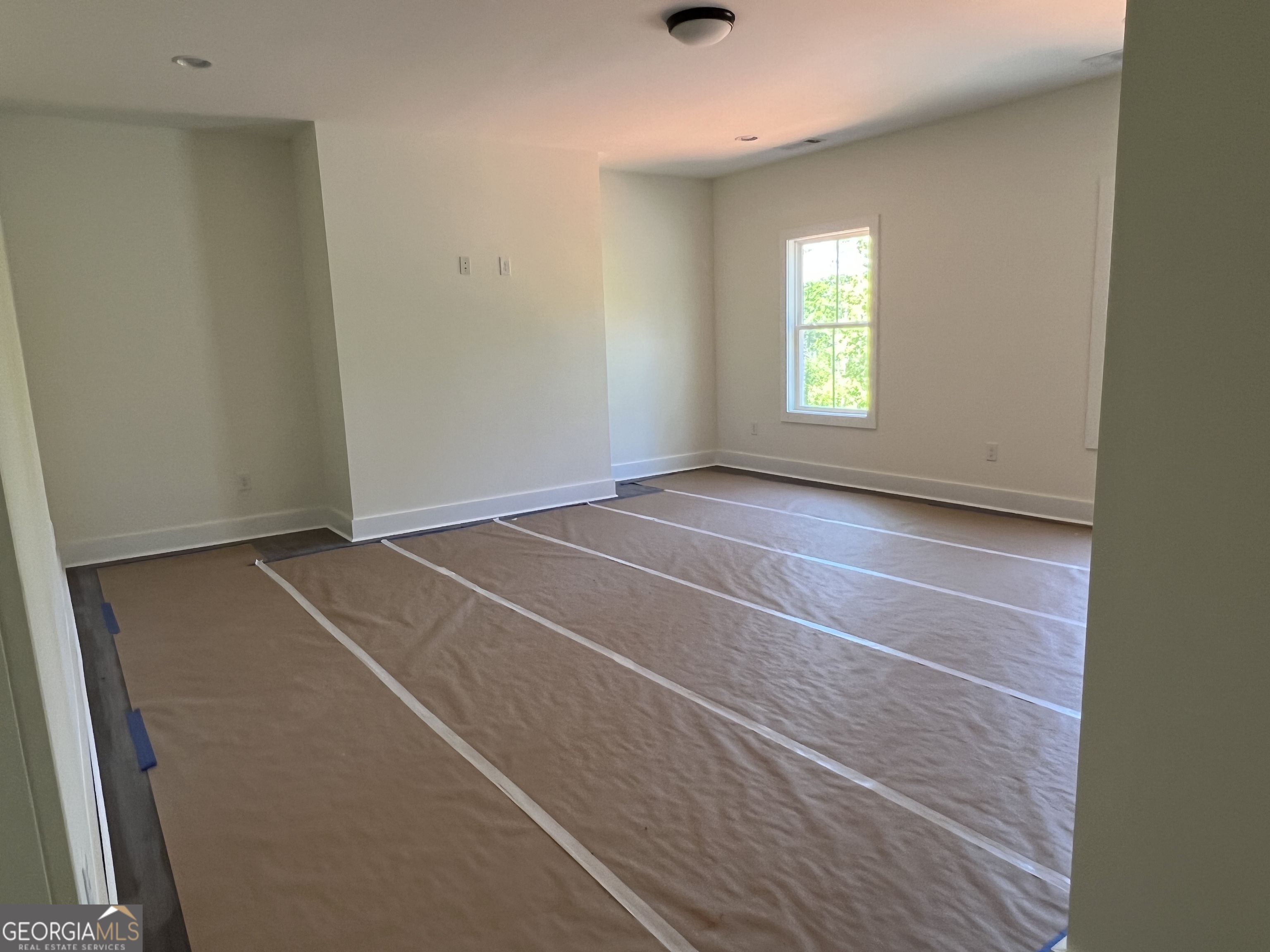 131 Hawthorne Lane Forsyth, GA 31029 - Photo 20 of 31 an empty room with windows