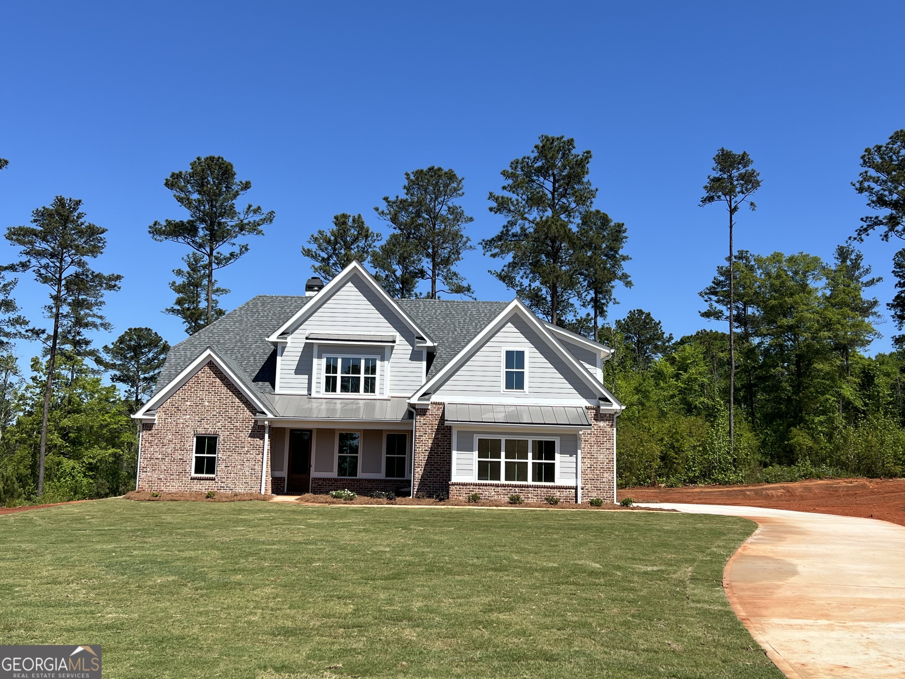 131 Hawthorne Lane Forsyth, GA 31029 - Photo 2 of 31 a front view of a house with a garden
