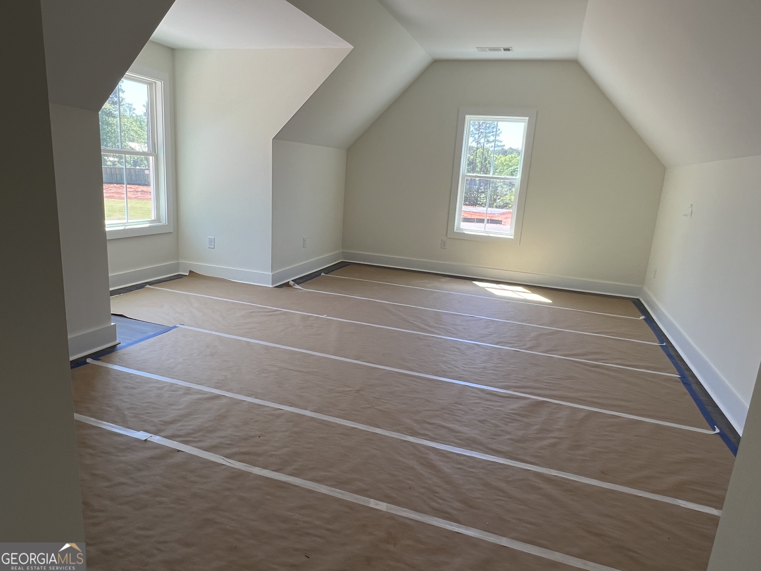 131 Hawthorne Lane Forsyth, GA 31029 - Photo 22 of 31 a view of an empty room with a window