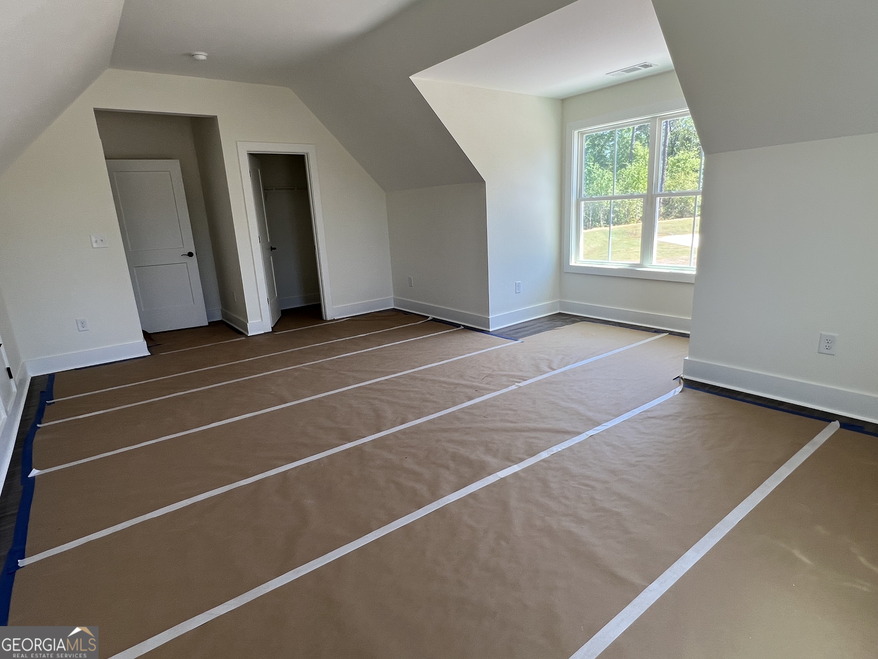 131 Hawthorne Lane Forsyth, GA 31029 - Photo 23 of 31 a view of a room with wooden floor and windows