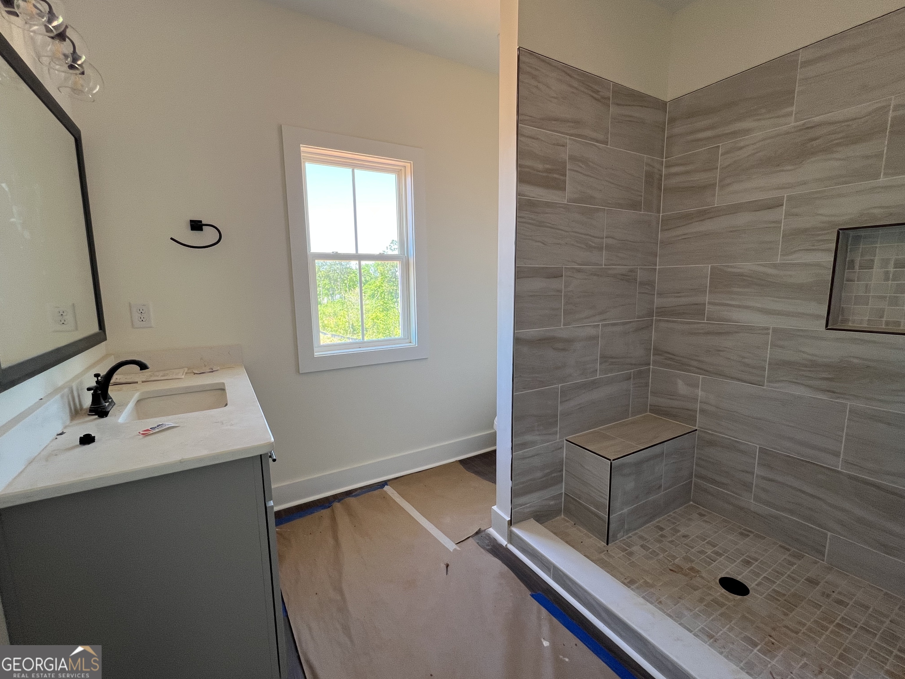 131 Hawthorne Lane Forsyth, GA 31029 - Photo 25 of 31 a bathroom with a sink a toilet and shower