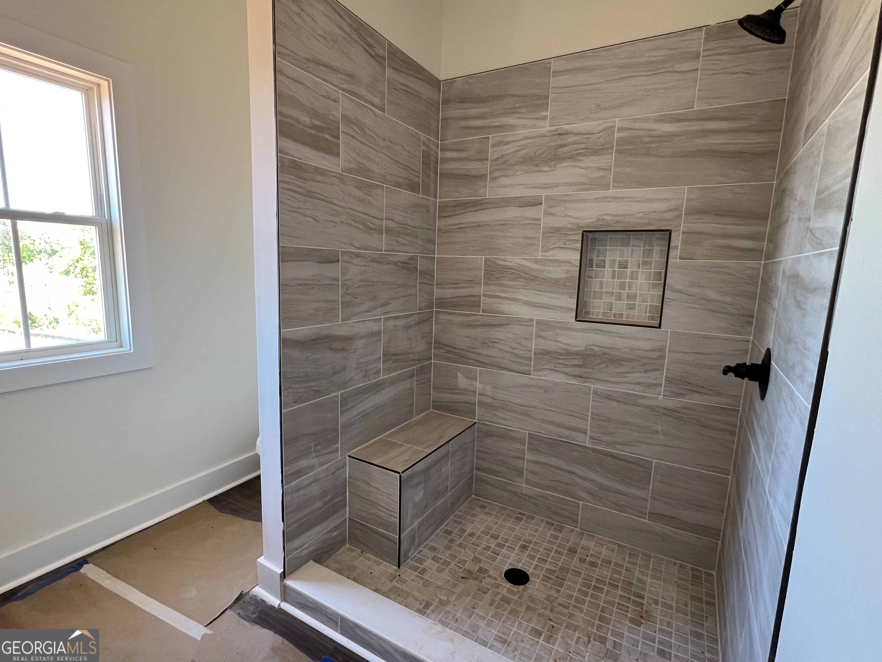131 Hawthorne Lane Forsyth, GA 31029 - Photo 26 of 31 a bathroom with a shower